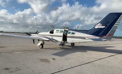 Cessna 402B C6-TJT operated by Blessings Aviation photo 2