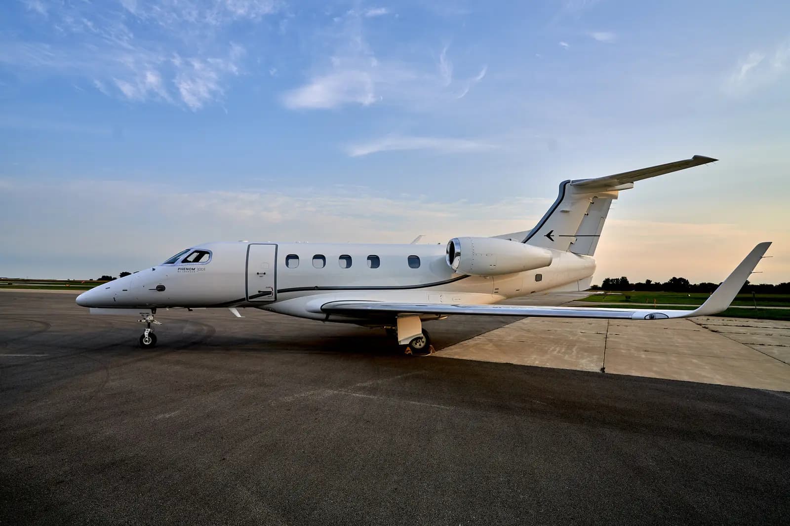 Embraer Phenom 300 N35EA operated by Synergy Flight Center, KBMI, exterior