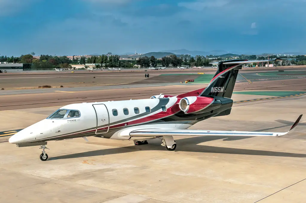Embraer Phenom 300 N66M operated by Latitude 33 Aviation, LLC, KCRQ, exterior