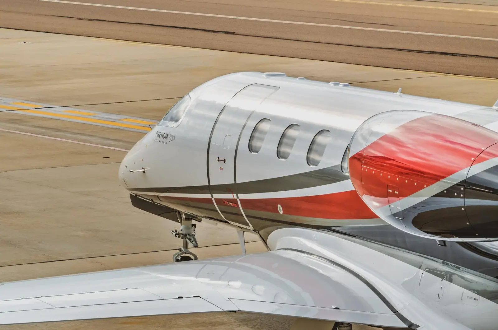 Embraer Phenom 300 N66M operated by Latitude 33 Aviation, LLC, KCRQ photo 5