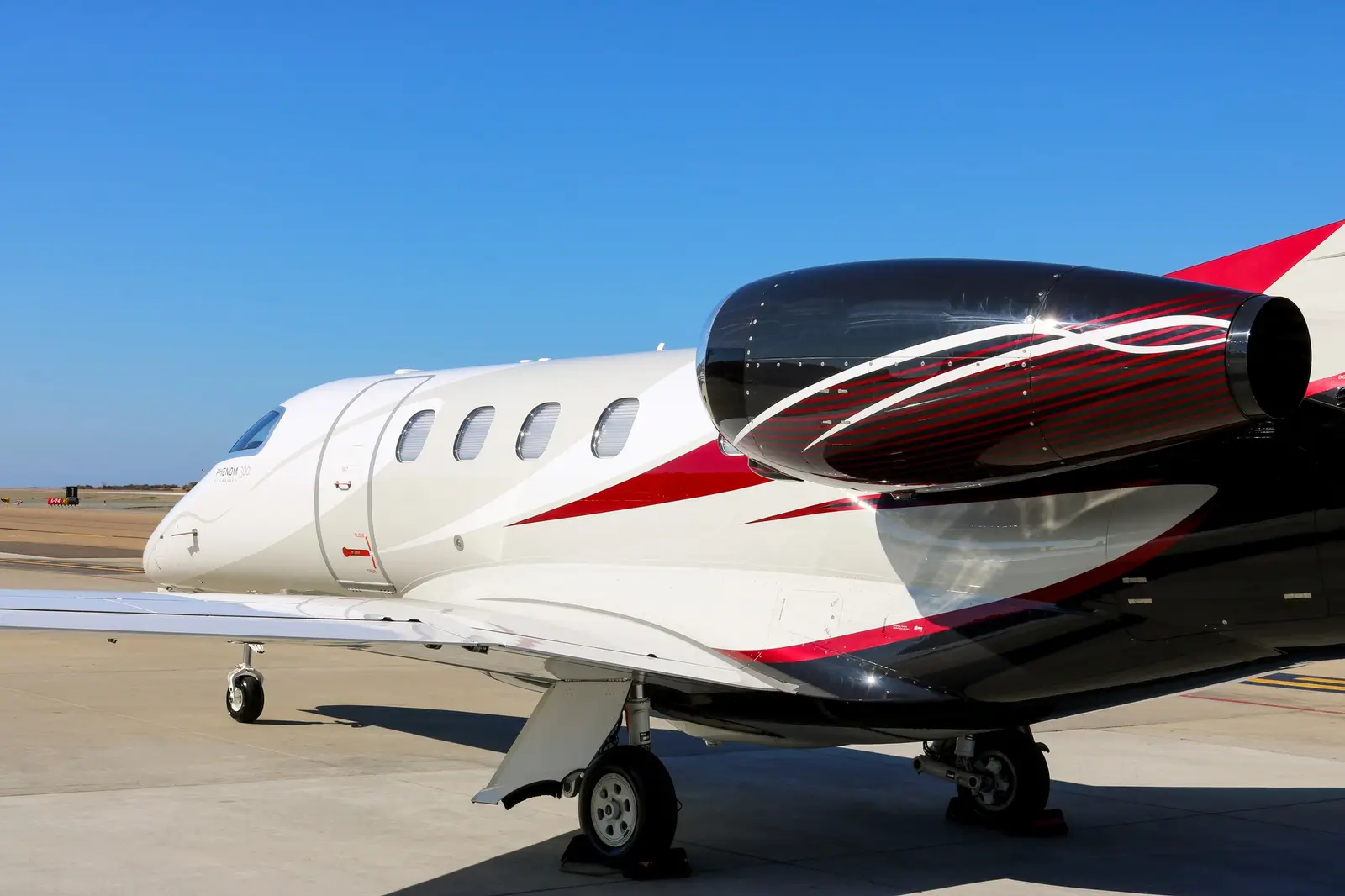 Embraer Phenom 300 N858EE operated by Latitude 33 Aviation, LLC, KCRQ, exterior
