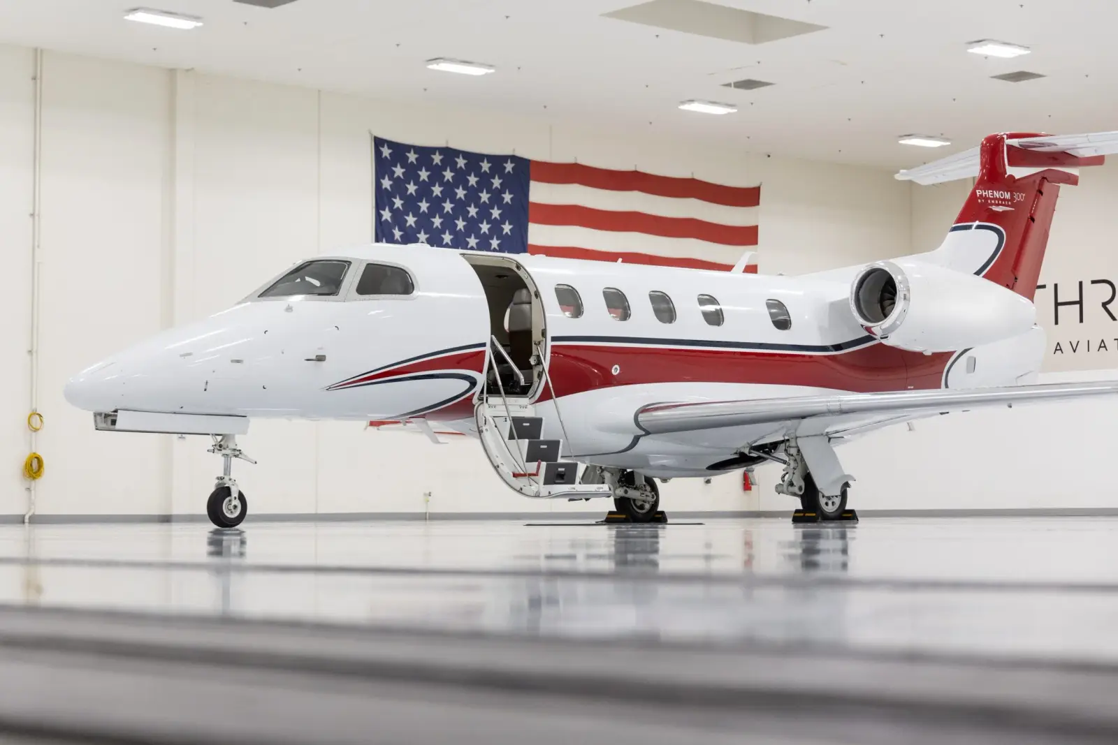 Embraer Phenom 300 N869MW operated by Thrive Aviation photo 4