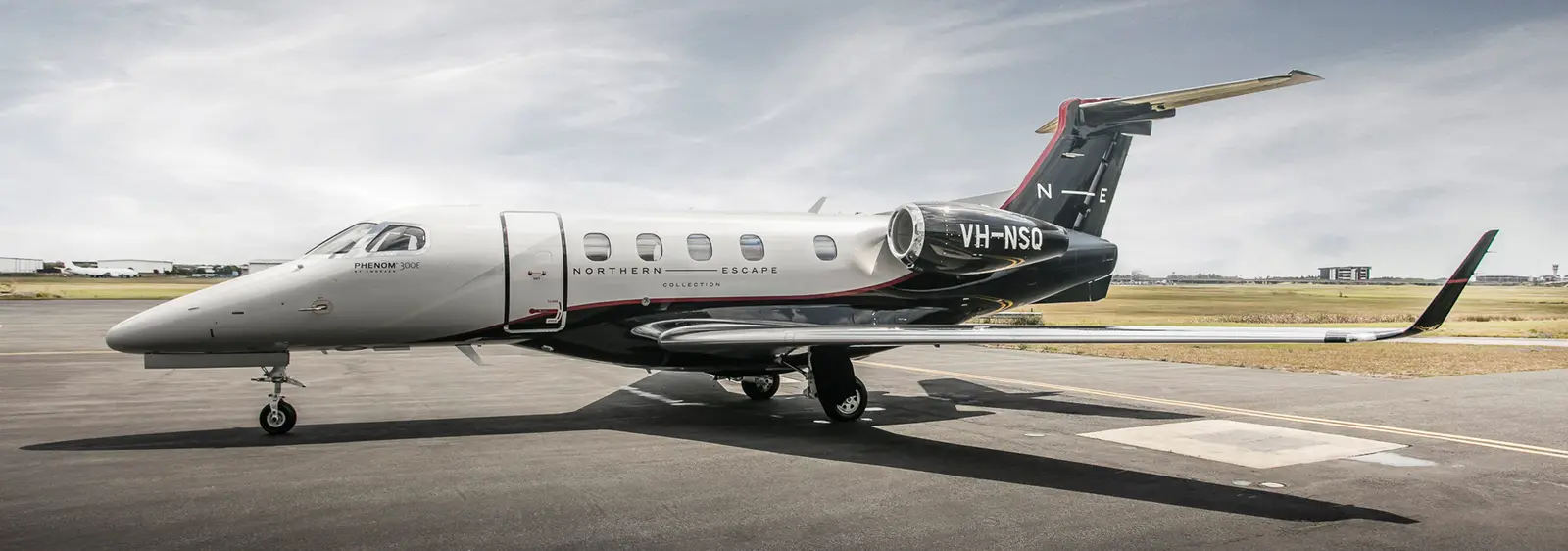 Embraer Phenom 300 VH-NSQ operated by Avcair, exterior