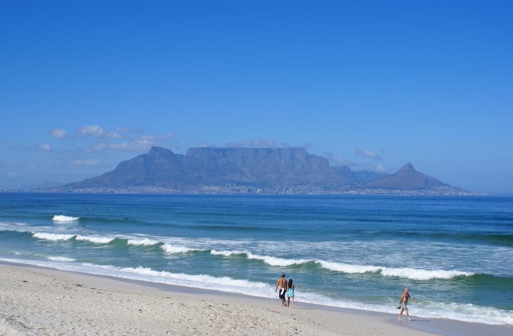 Table Mountain looming over Cape Town's harbor and Atlantic seaboard at golden hour