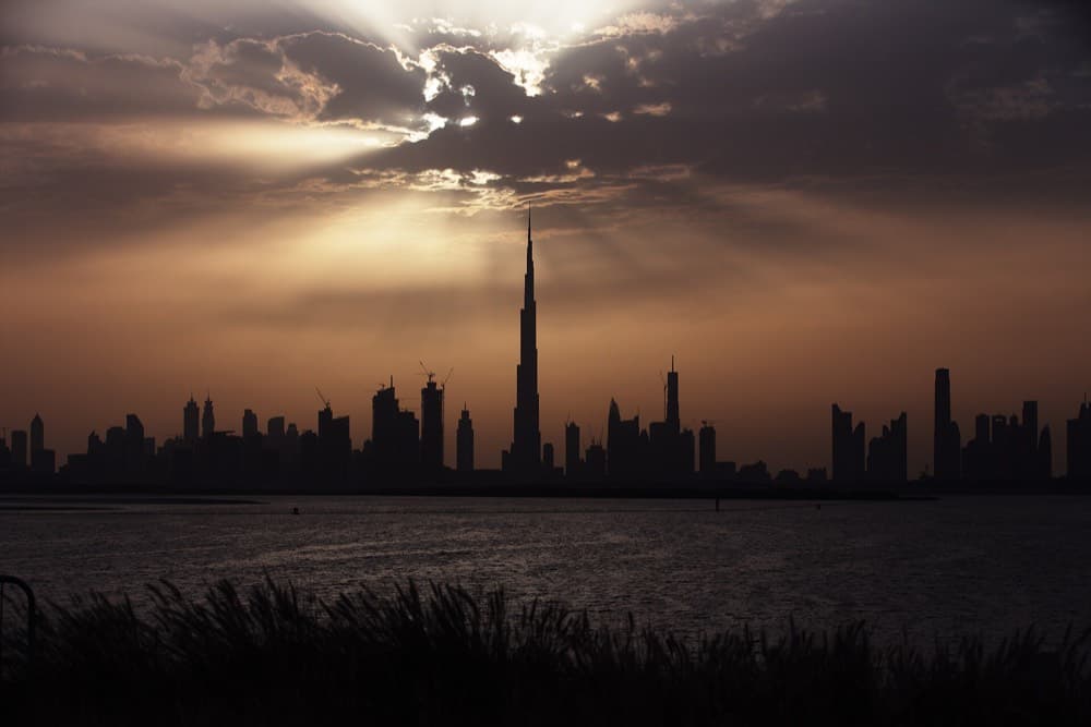 Dubai skyline with the Burj Khalifa towering over the marina at golden hour