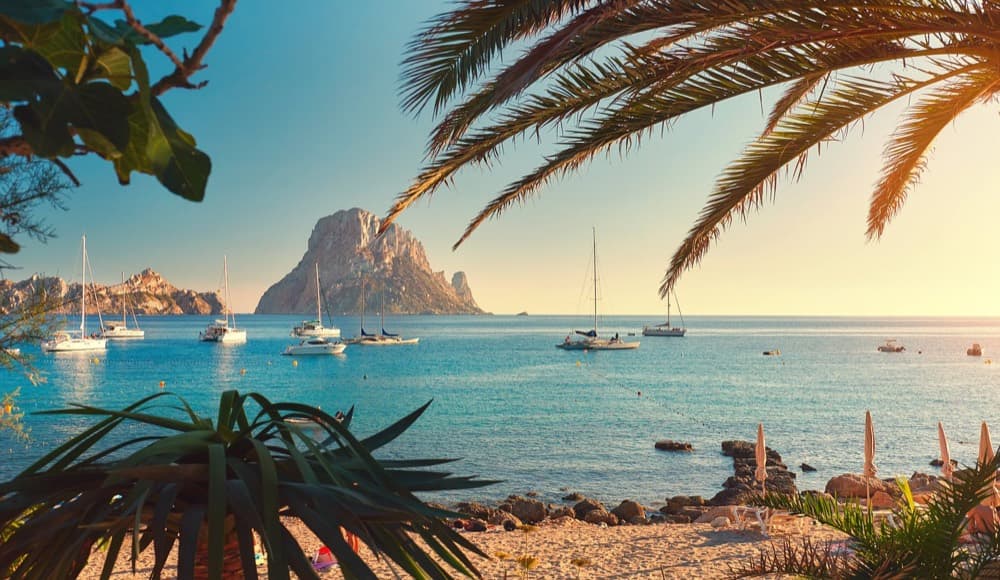 Whitewashed Dalt Vila old town above Ibiza's harbor and Mediterranean blue