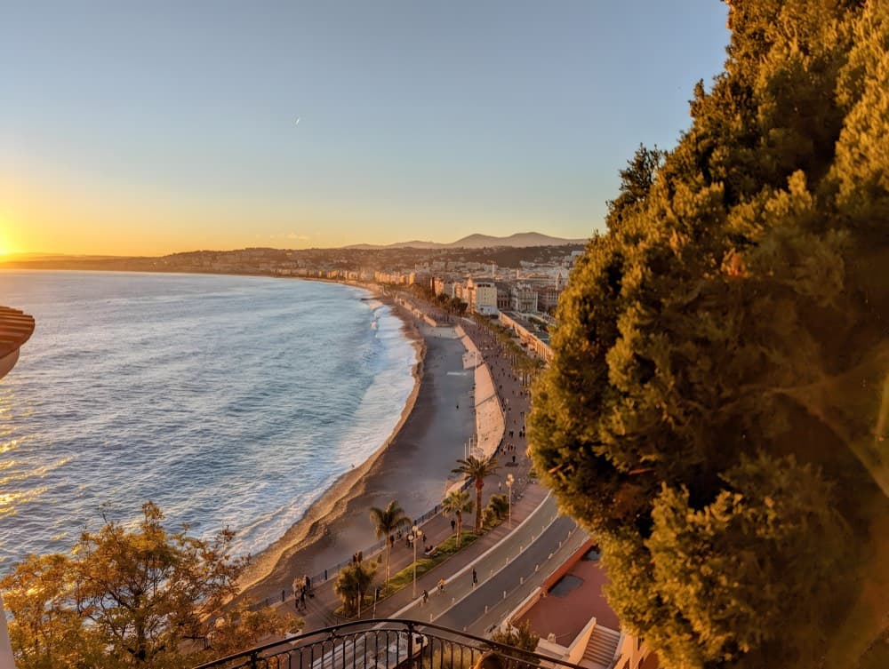 The curving Promenade des Anglais and turquoise Baie des Anges along the Cote d'Azur