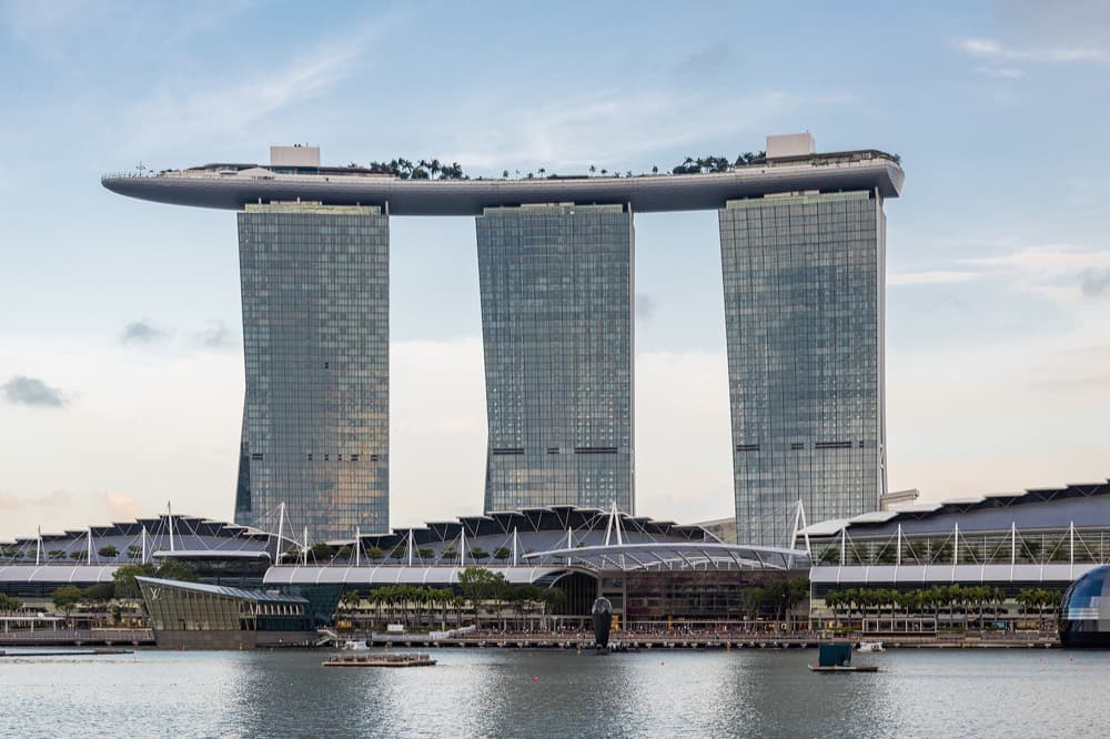 Marina Bay skyline with the waterfront hotels and gardens lit after dark