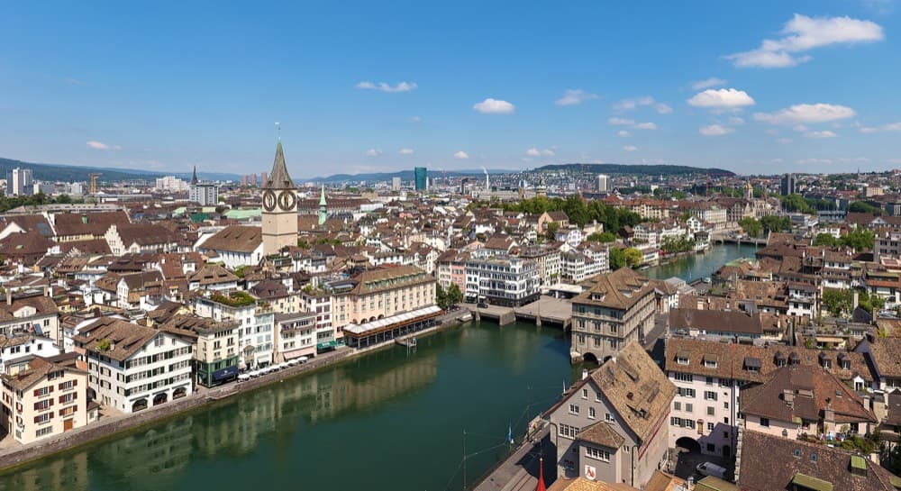 Zurich's old town and Limmat river with the lake and Alps in the distance