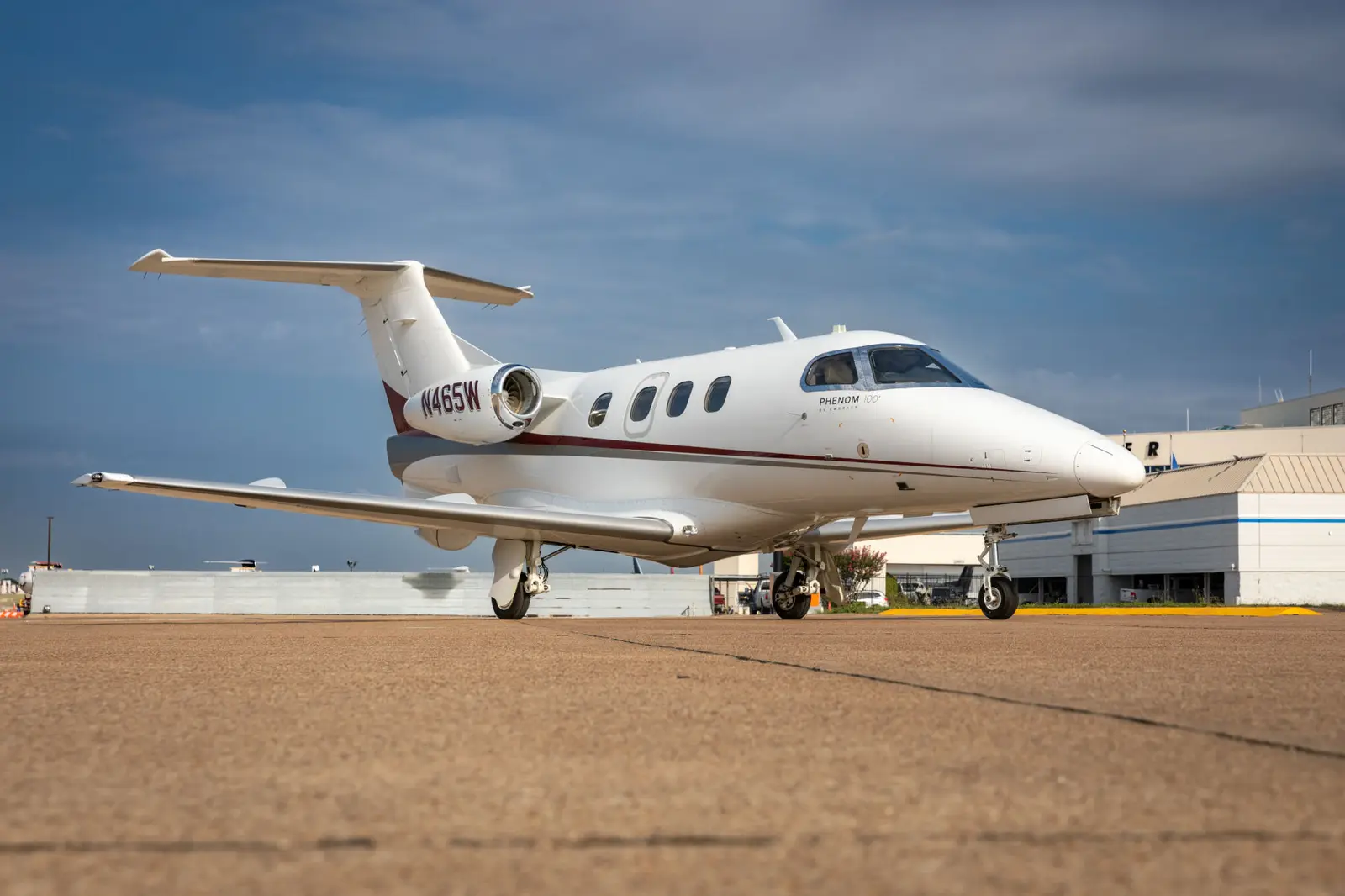 Embraer Phenom 100 N465W operated by QuikCharter, exterior